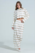 THE SNEAK PEEK STUDDED PU MIDI SKIRT IN WHITE