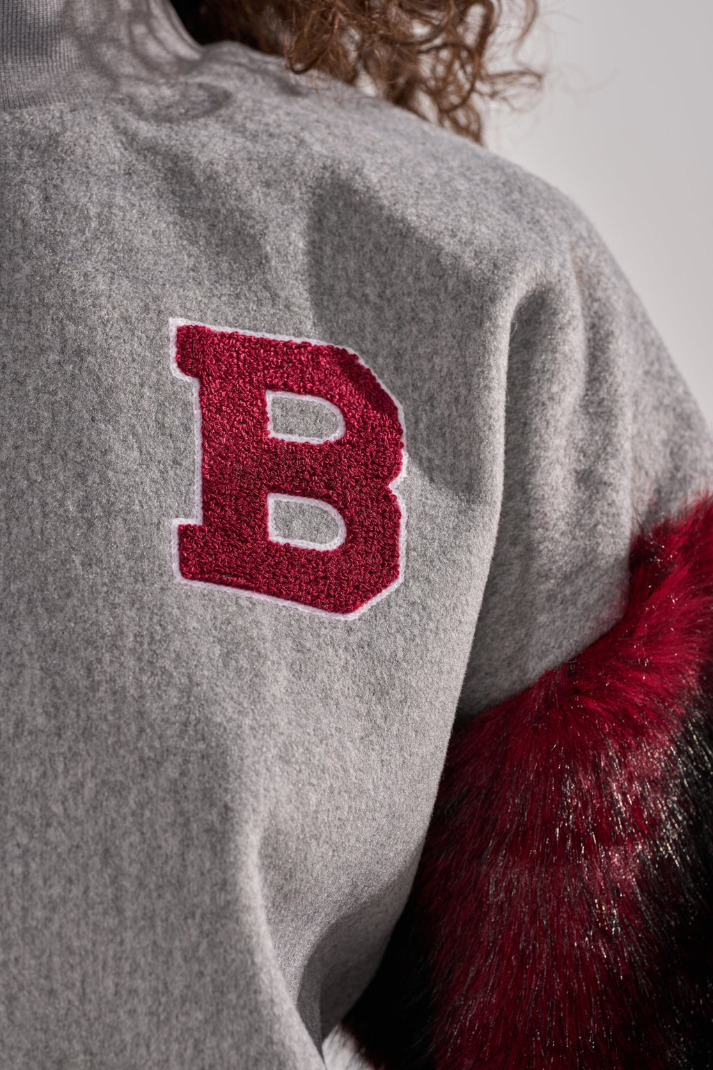 NEW EAST SIDE FAUX FUR SLEEVE SWEATSHIRT