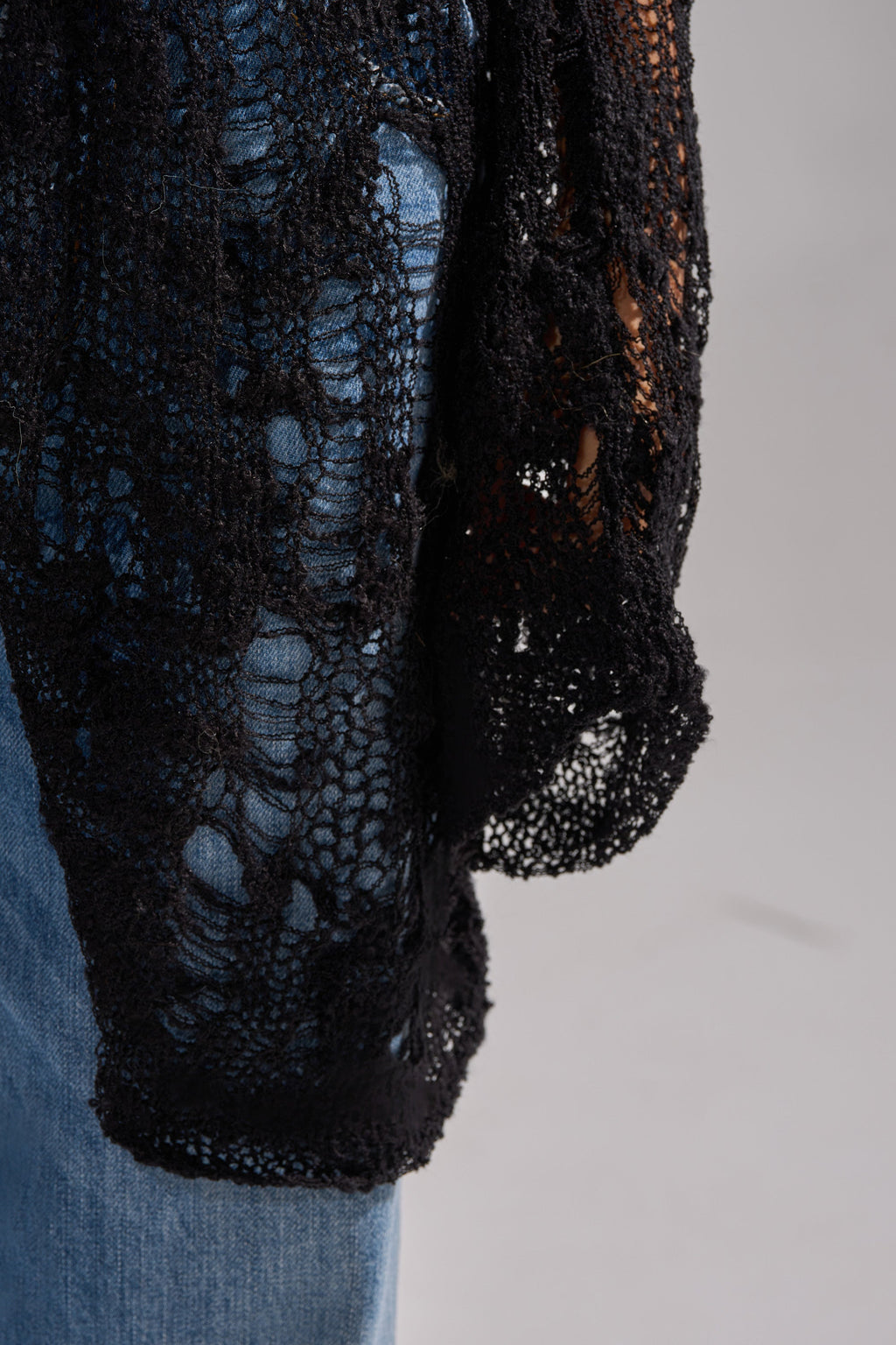 ASYMMETRICAL KNIT SWEATER