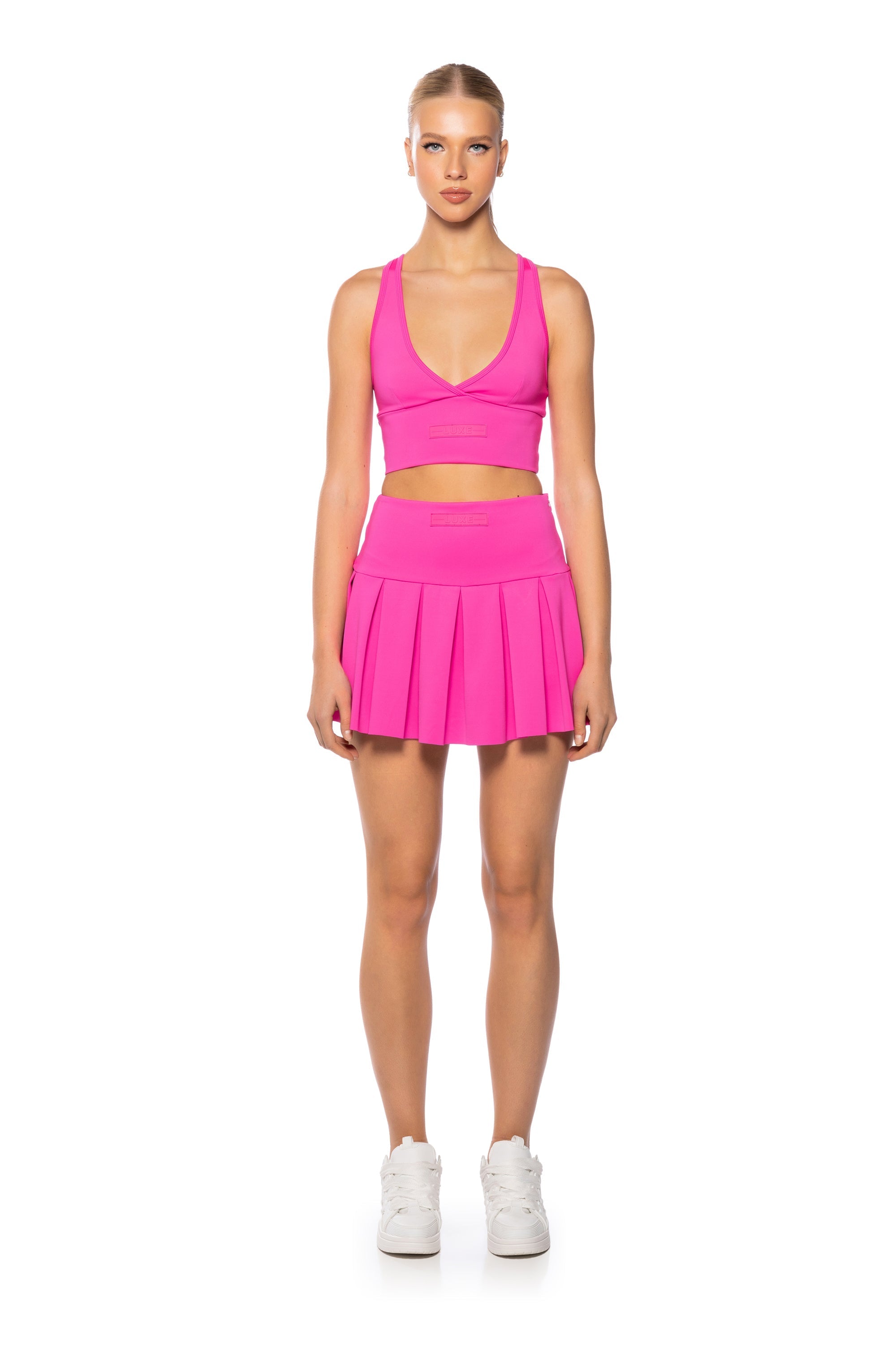 ITS THE PAXTON LUXE PLEATED SKORT IN NEON PINK